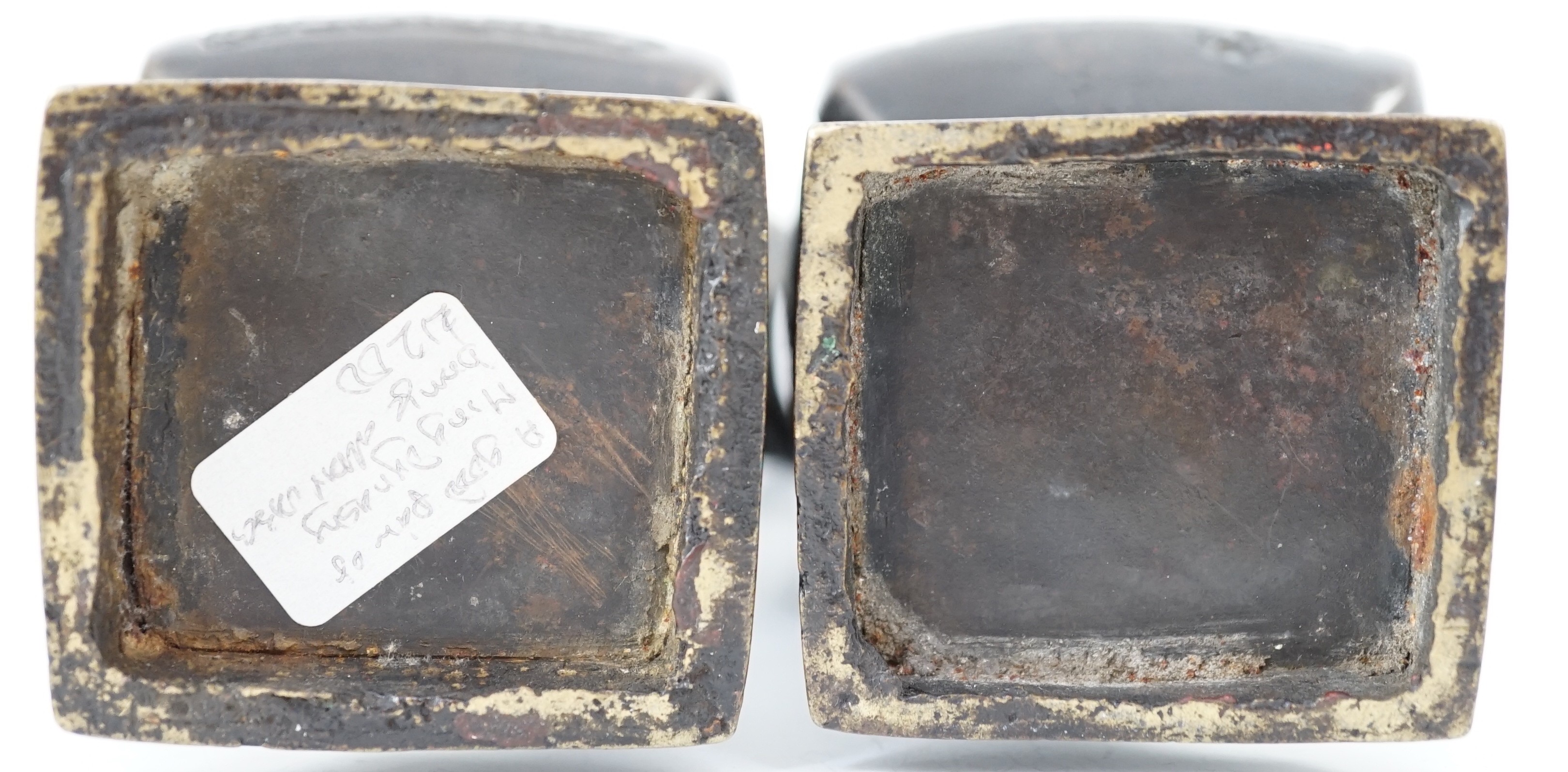 A pair of Chinese archaistic bronze two handled altar vases, Ming dynasty, 23cm high
